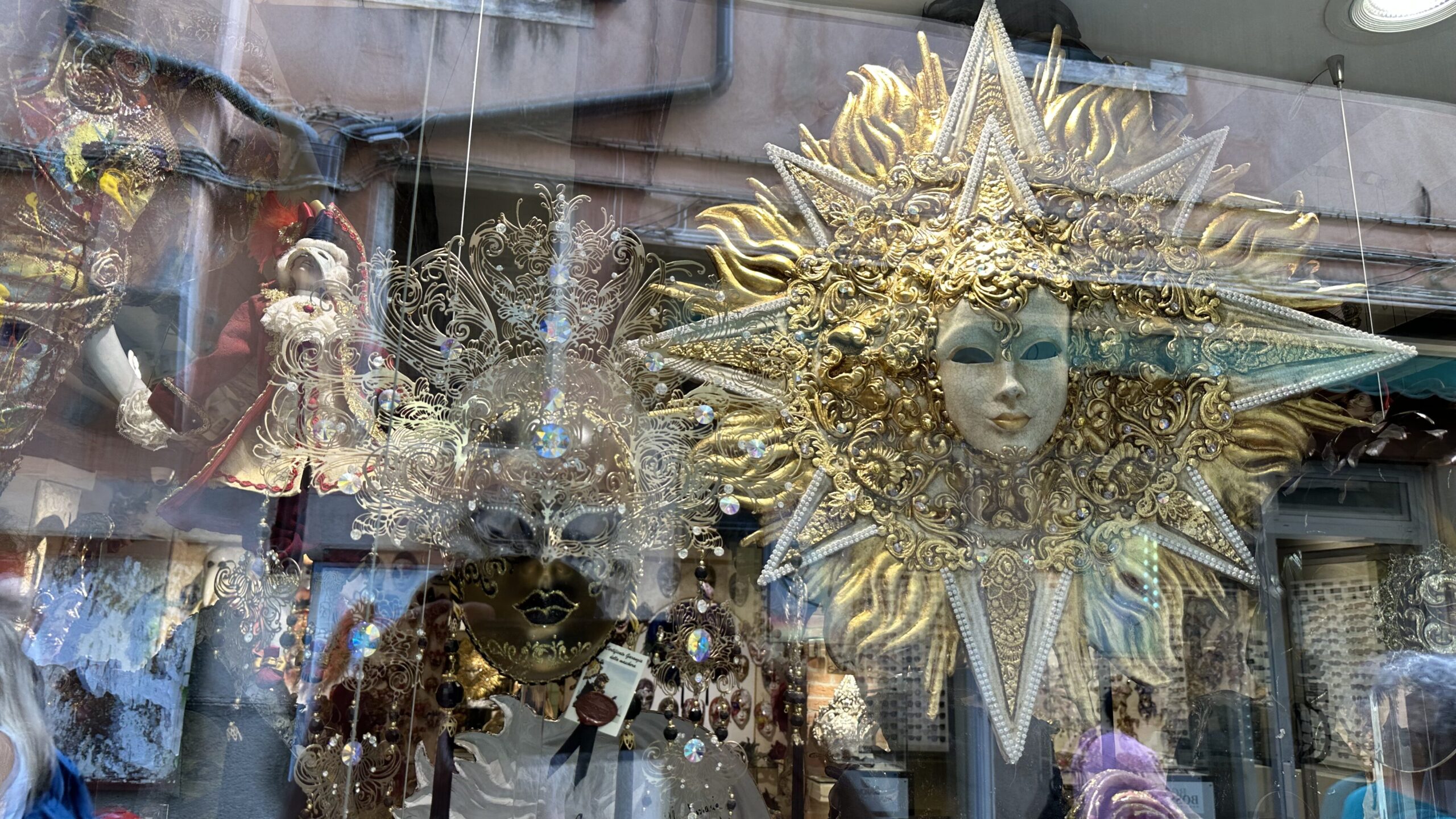 Elaborate Venetian Carnaval masks in a shop window in Venice