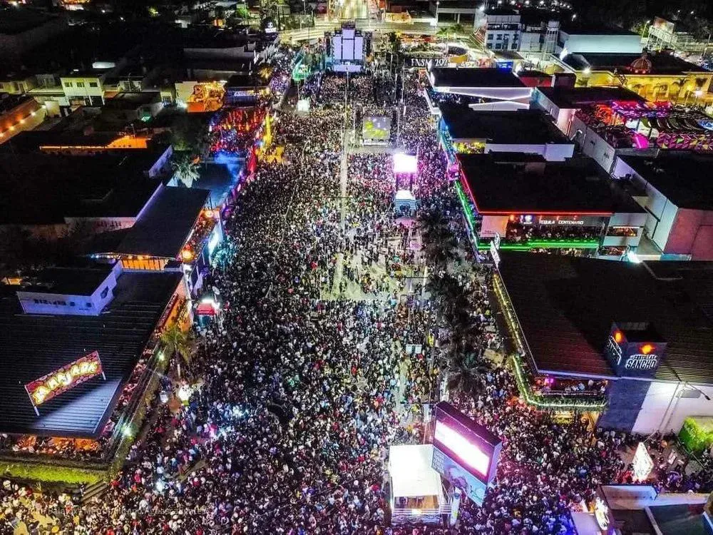 Large crowd at night during Feria San Marcos in downtown Aguascalientes Mexico