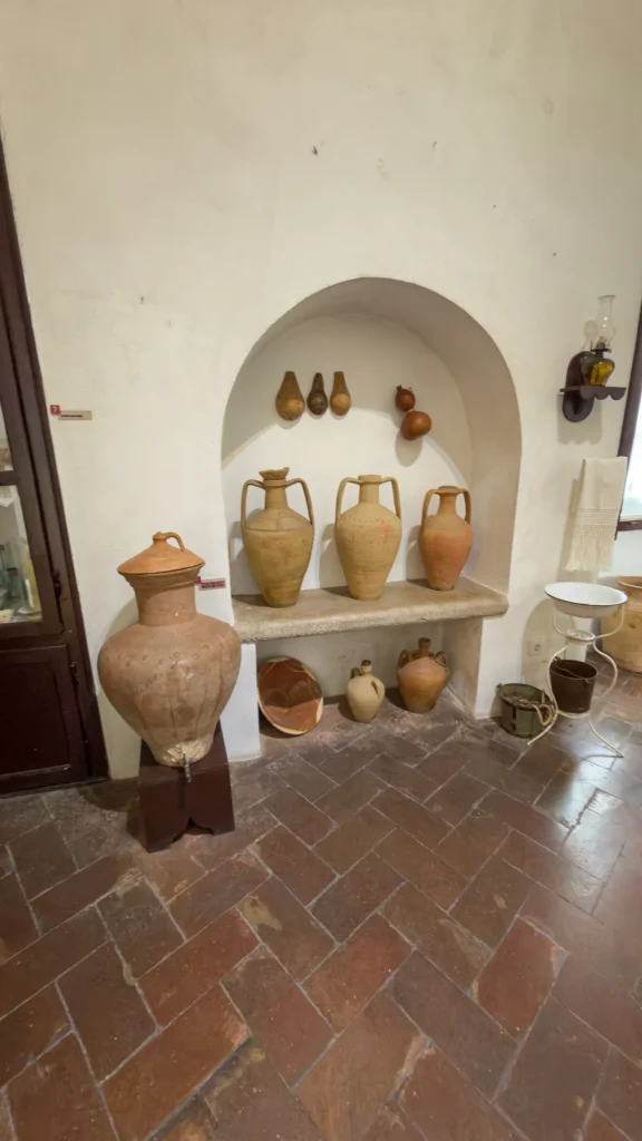 Traditional pottery and ceramic vessels displayed inside the Loulé Castle Museum in Portugal.