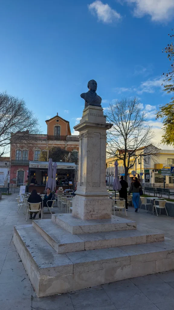 Historic monument in Praça da República surrounded by cafés in Loulé, Portugal.